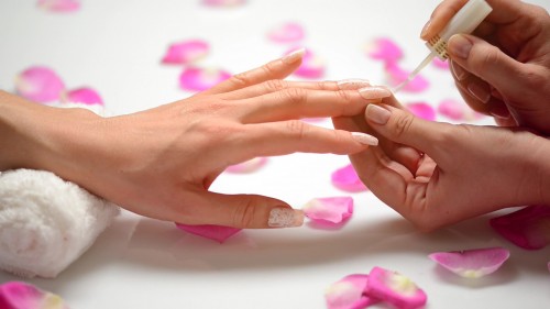 stock-footage-manicure-nail-polish-woman-in-a-beauty-salon-receiving-a-manicure-by-a-beautician-hd-video